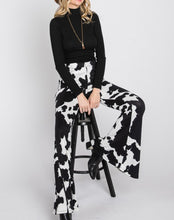 Load image into Gallery viewer, Cow Print Bell Bottoms
